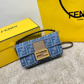 The iconic Baguette small handbag is made of light blue denim, decorated with FF pattern, beige calfskin trim and FF buckle. Front flip, magnetic buckle, fabric-lined internal compartment with pockets and gold-finished metal pieces. The handbag comes with a removable handle and chain shoulder straps for carrying, shoulder or crossbody. Model: 9917 denim orchid Size: 20-13-5cm