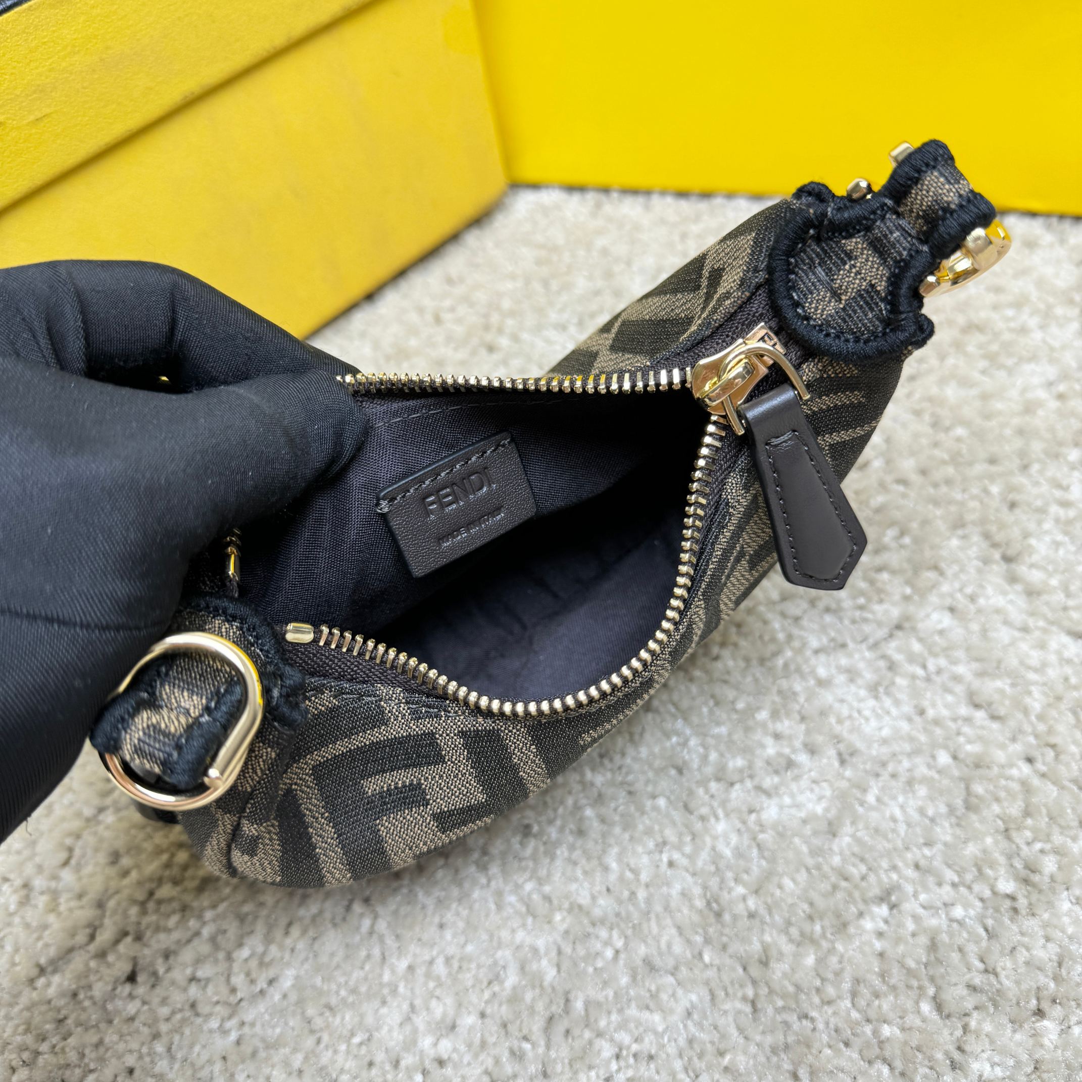 Fendography Nano version of crescent bag, zippered closure, decorated with FENDI retro gold metallic words. It is equipped with adjustable clamp straps, which can be hung on a large bag or worn on the wrist. With shoulder strap hook buckle. Classic FF jacquard fabric material. Brown napa leather details. Gold finish metal parts. Size: 16.5-14-5cm Model: 9933 Old Flower - Image 8